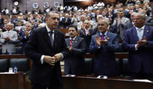 Parliament applauds Turkish president Tayyip Erdogan before his address in Ankara, Turkey, (AP Photo/Burhan Ozbilici)