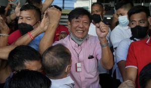 Presidential candidate Ferdinand ÅgBongbongÅh Marcos Jr. celebrates as he greets the crowd outside his headquarters in Mandaluyong, Philippines on Wednesday, May 11, 2022. Marcos, the namesake son of longtime dictator Ferdinand Marcos, apparent landslide victory in the Philippine presidential election is raising immediate concerns about a further erosion of democracy in Asia and could complicate American efforts to blunt growing Chinese influence and power in the Pacific.(AP Photo/Aaron Favila)